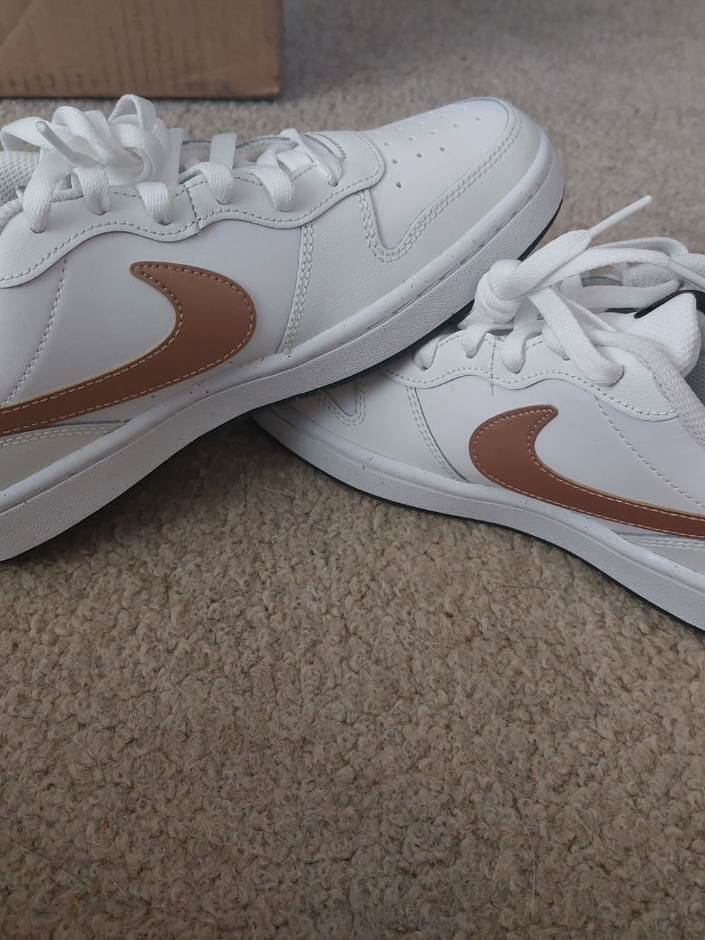 Nike Kids White Sneakers with Tan Swoosh
